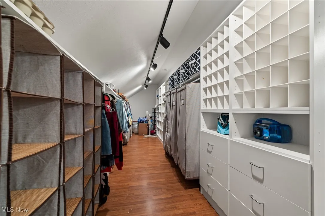 Spacious closet with wood finished floors
