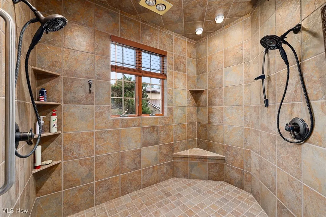 Full bathroom with a tile shower