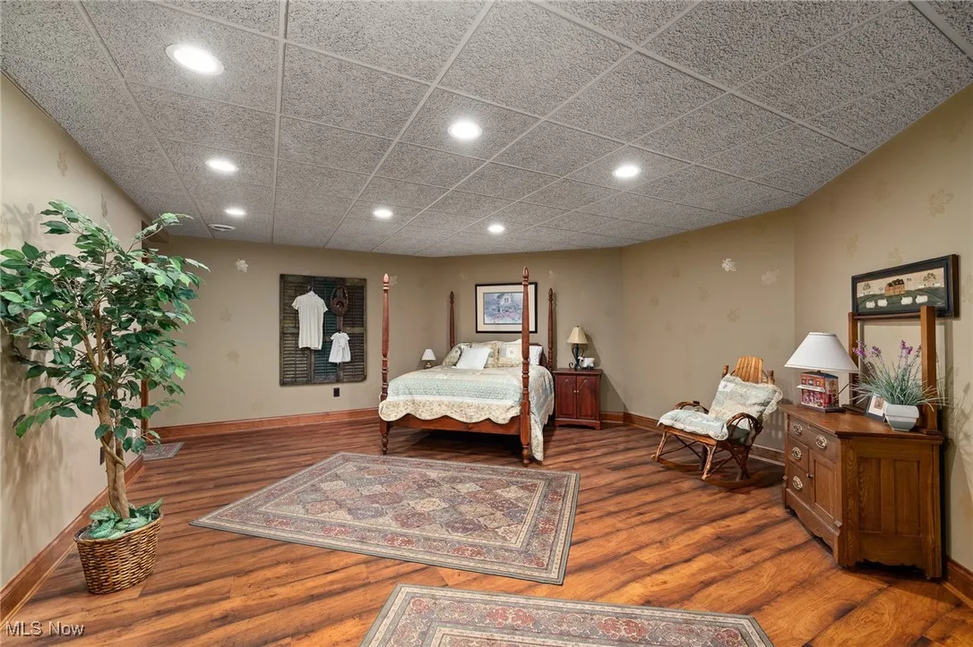 Bedroom with recessed lighting, baseboards, and wood finished floors