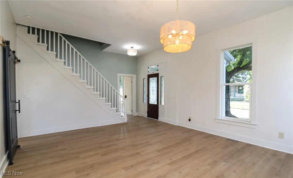 Living room with front door entry.