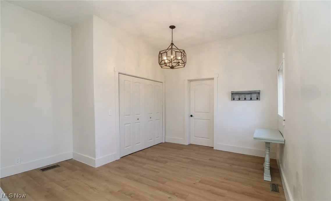 Dining room area/Laundry area behind doors, and full bath