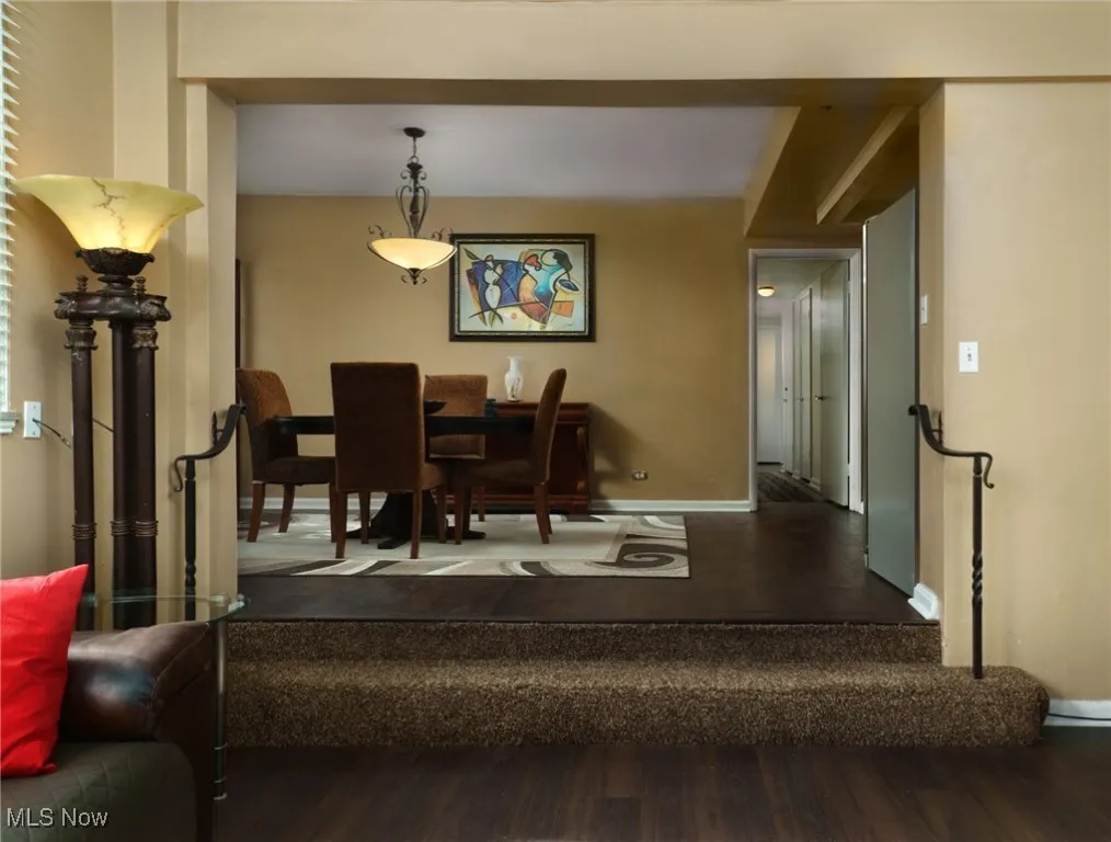 Dining space with wood finished floors and baseboards