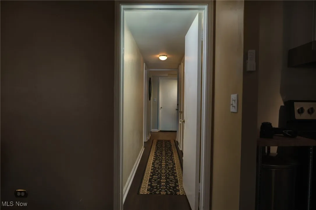 Hallway featuring baseboards