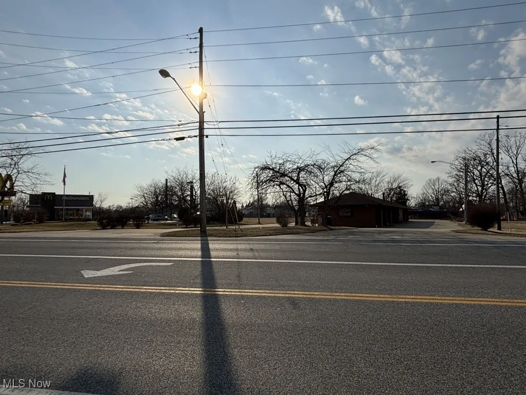 View of street featuring sidewalks and street lighting