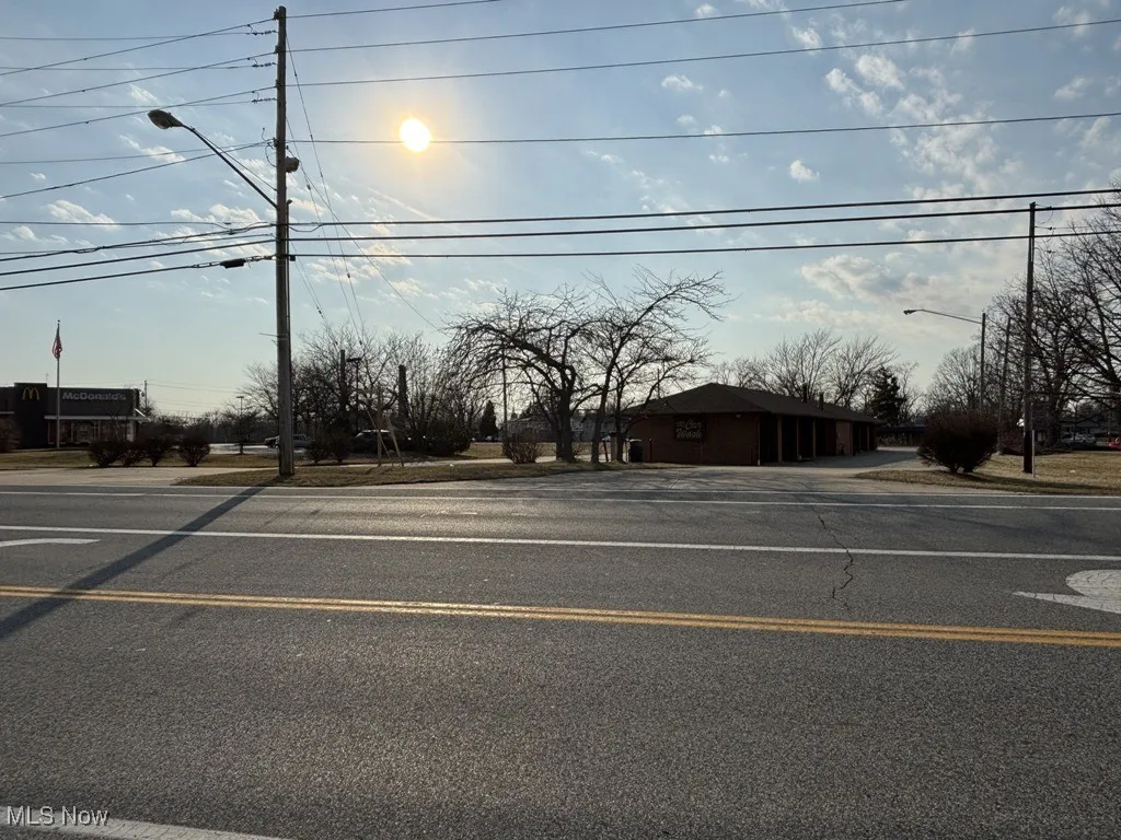 View of street featuring street lights and sidewalks