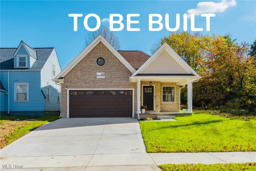 View of front facade featuring driveway, covered porch, an attached garage, a front yard, and brick siding