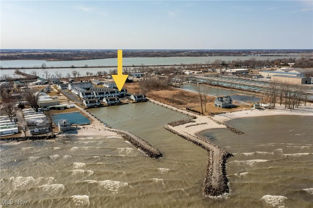 Birds eye view of property with a water view