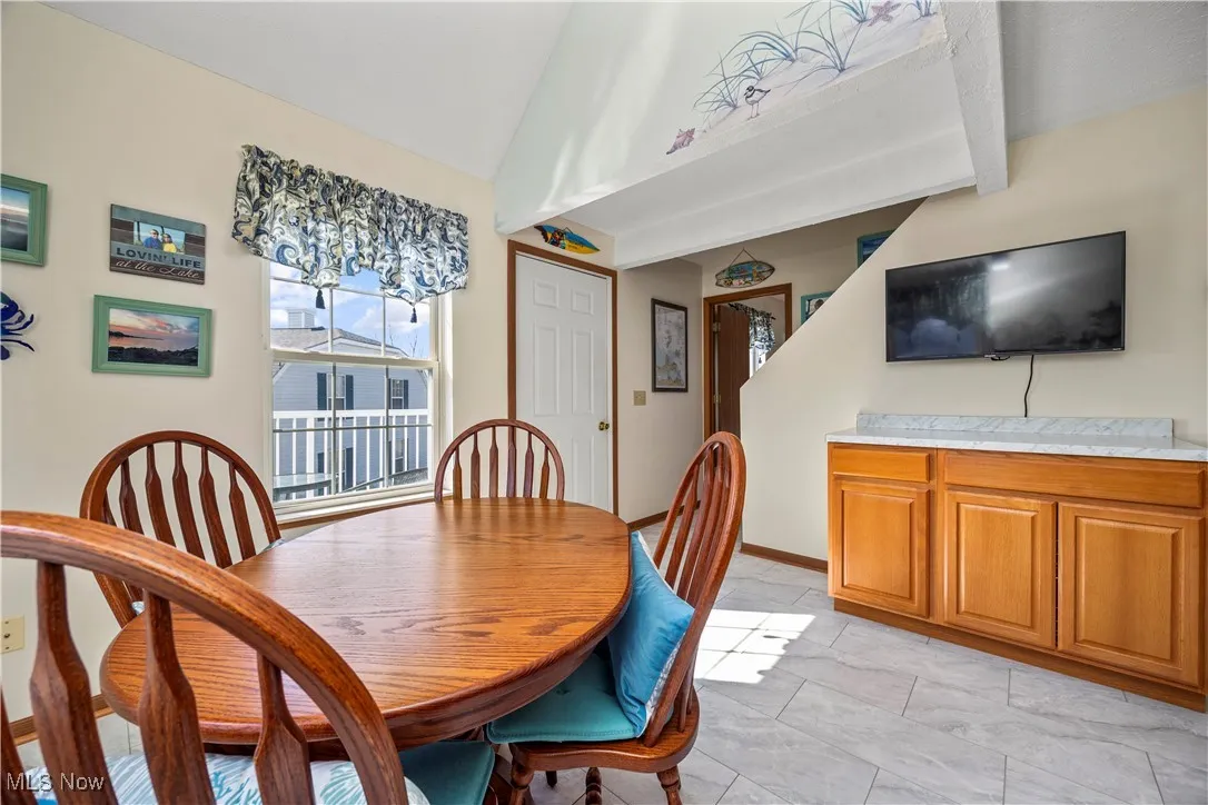 Dining room with vaulted ceiling