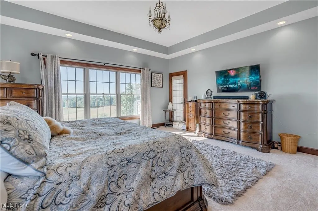 Bedroom featuring recessed lighting, baseboards, and carpet floors