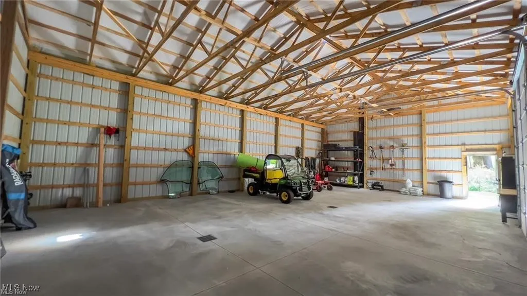Garage featuring metal wall