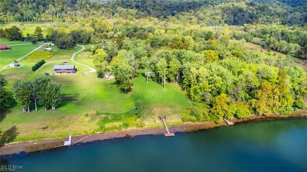 Bird's eye view with a view of trees and a water view