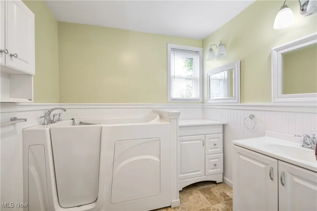 Main floor bathroom with walk in bathtub