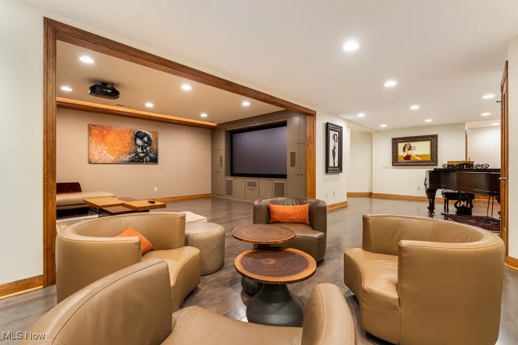 Cinema room featuring recessed lighting, baseboards, and wood finished floors