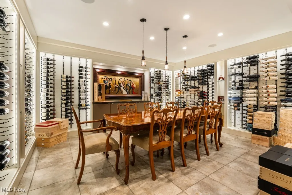 Wine room featuring tile patterned flooring and recessed lighting