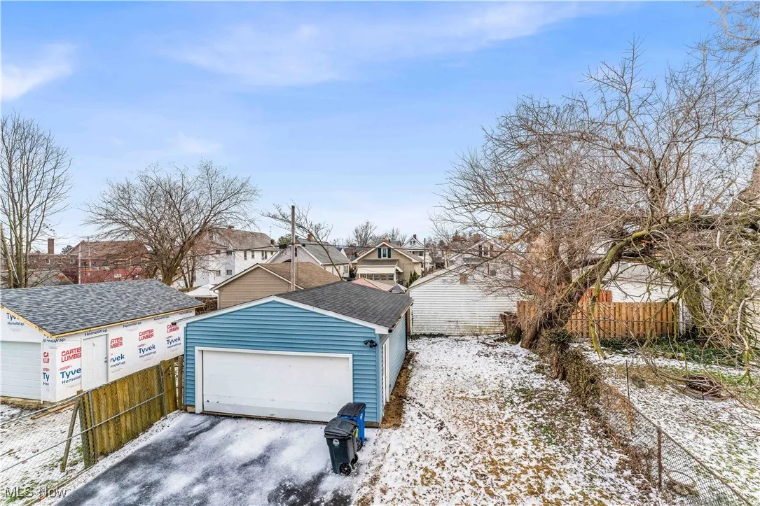 Garage featuring fence