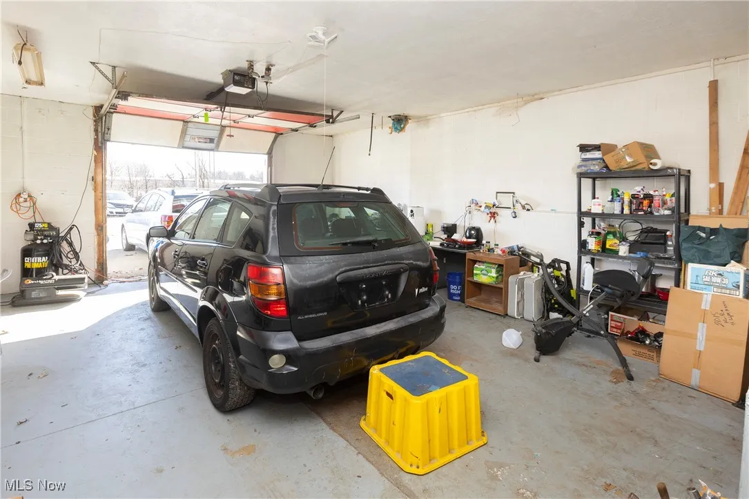 Garage featuring a garage door opener