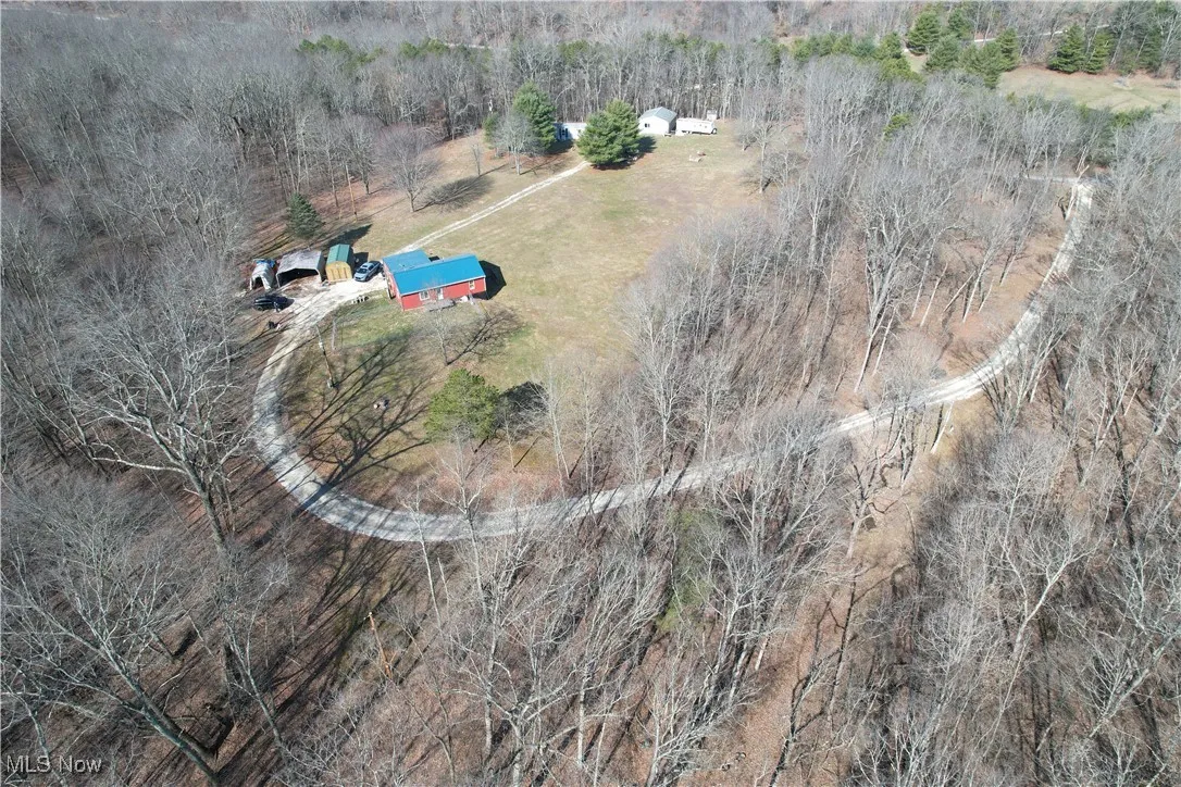Birds eye view of property with a rural view