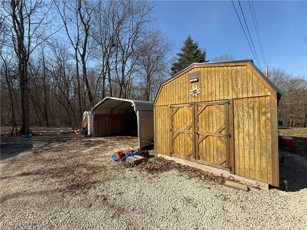 View of shed featuring a detached carport