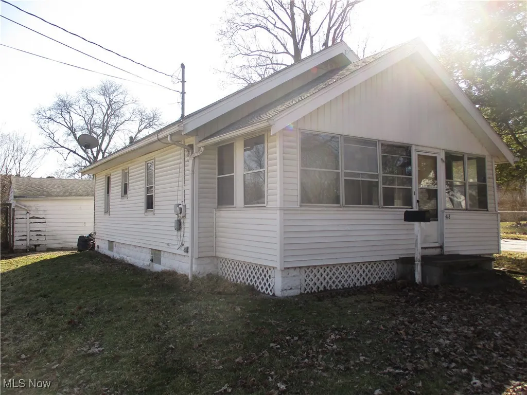 View of home's exterior featuring a yard