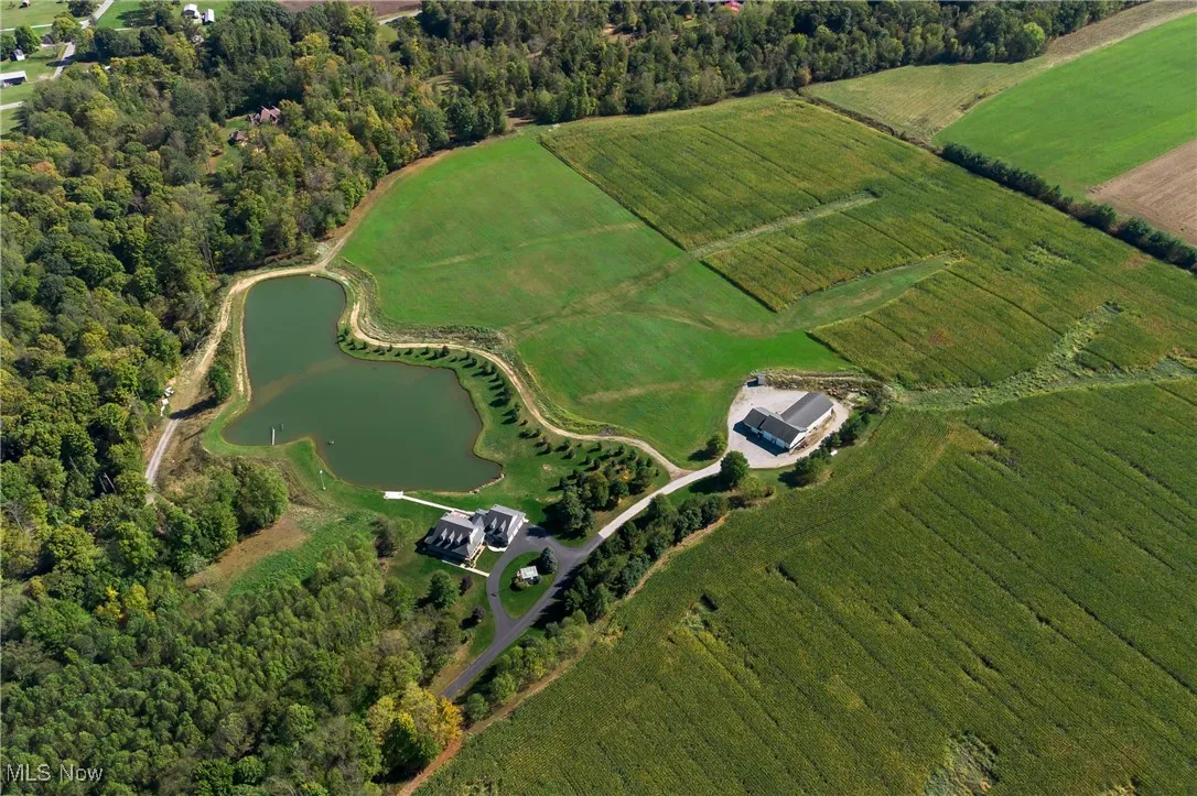 Drone / aerial view featuring a water view and a rural view