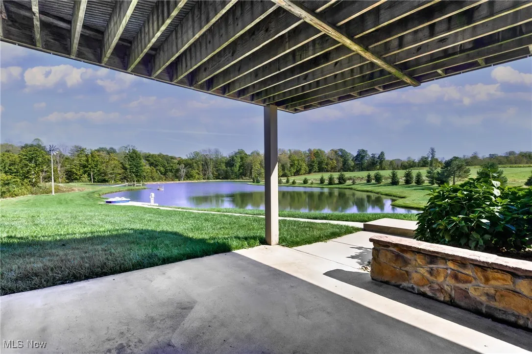View of patio / terrace featuring a water view