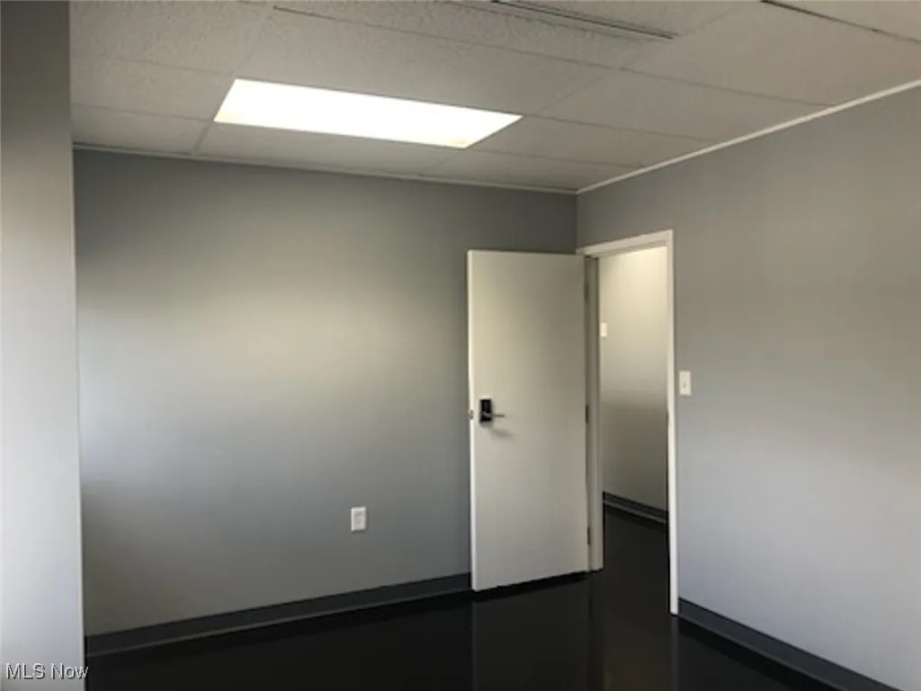 Unfurnished room featuring a paneled ceiling