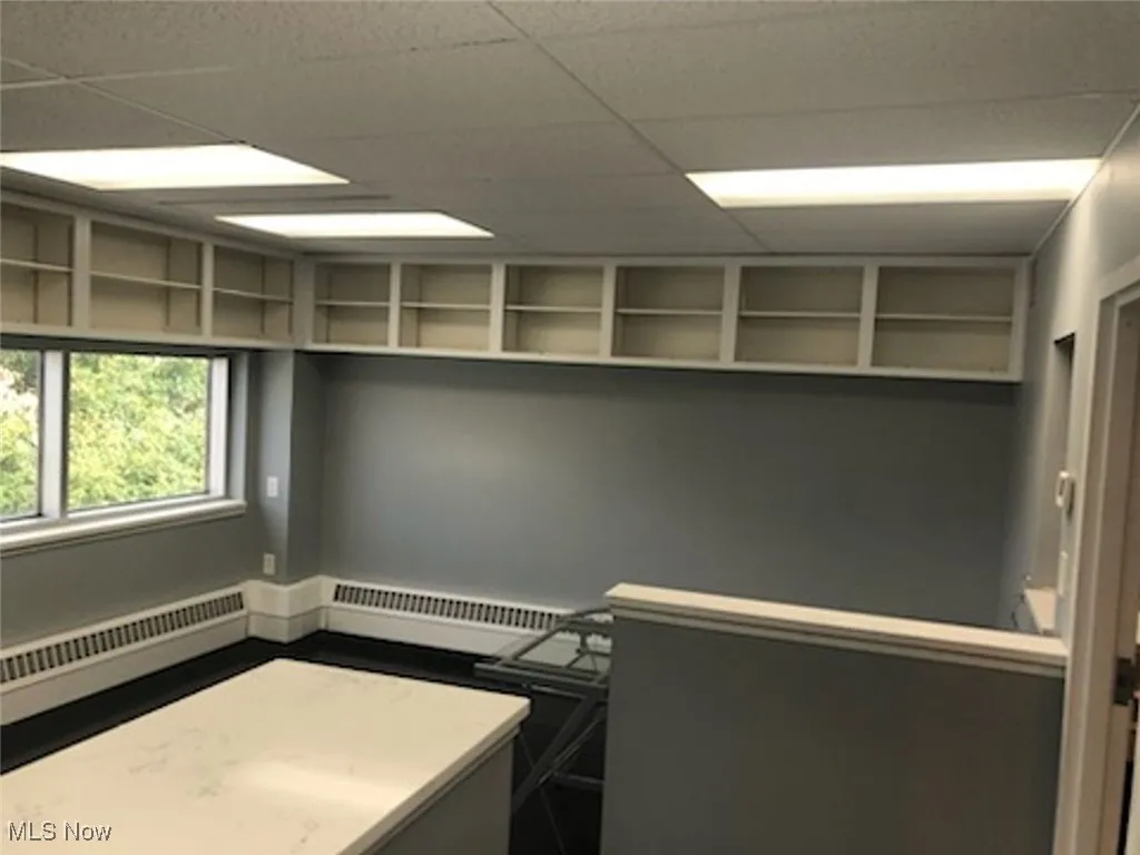Laundry room featuring a baseboard heating unit