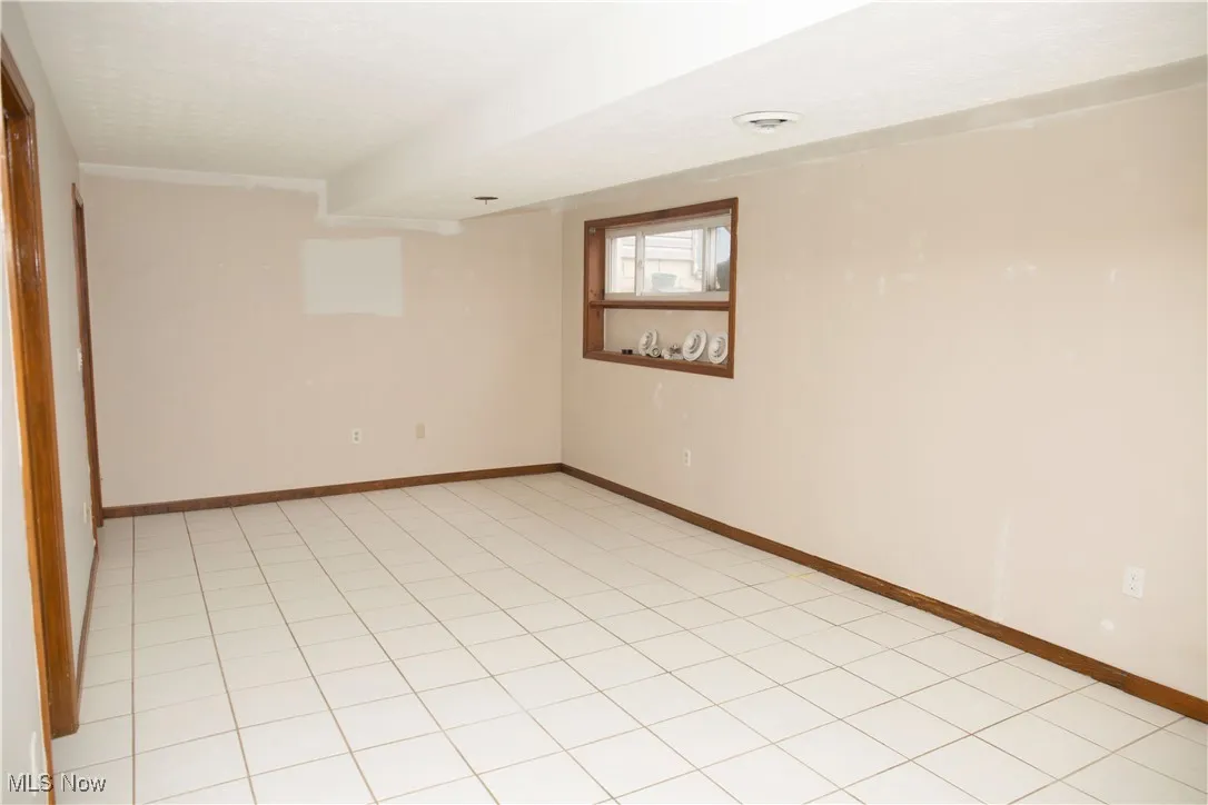 Empty room with baseboards