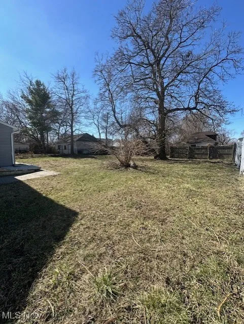 View of yard featuring fence