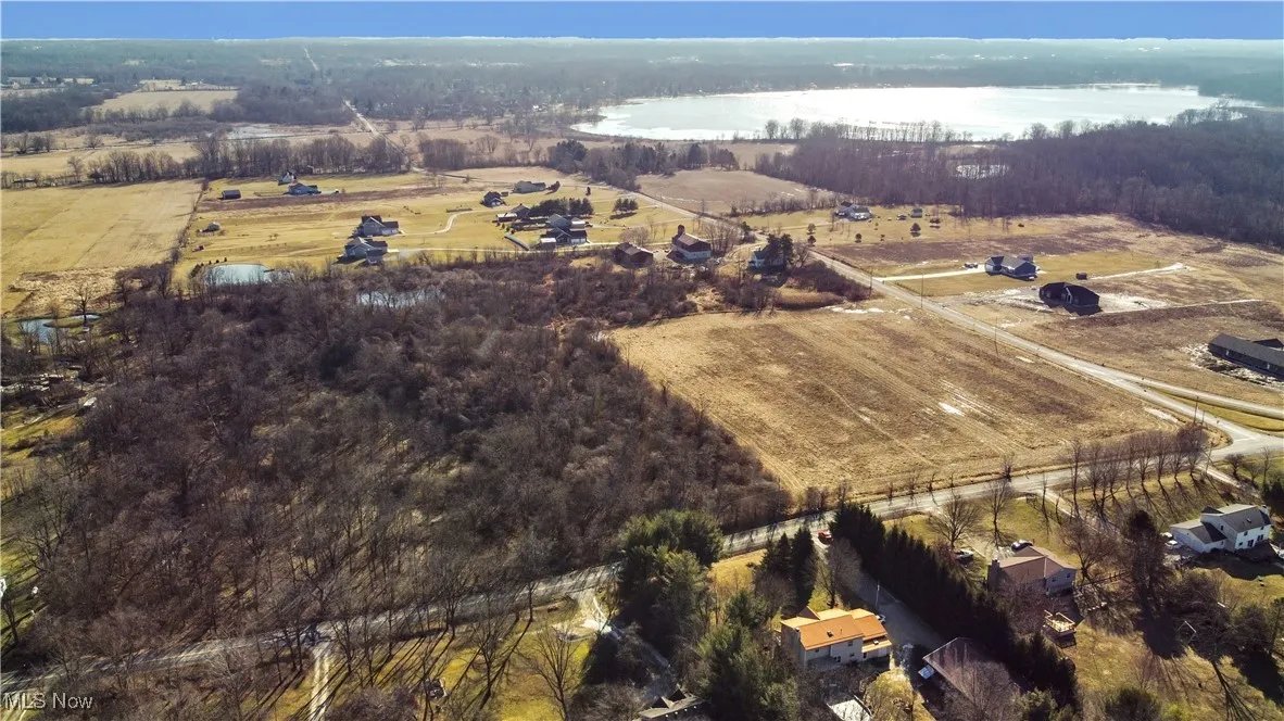 Bird's eye view with a water view and a rural view
