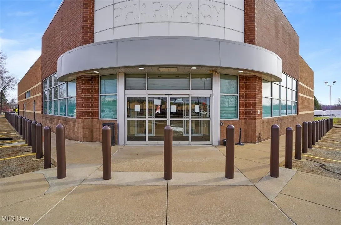 View of building exterior with fence