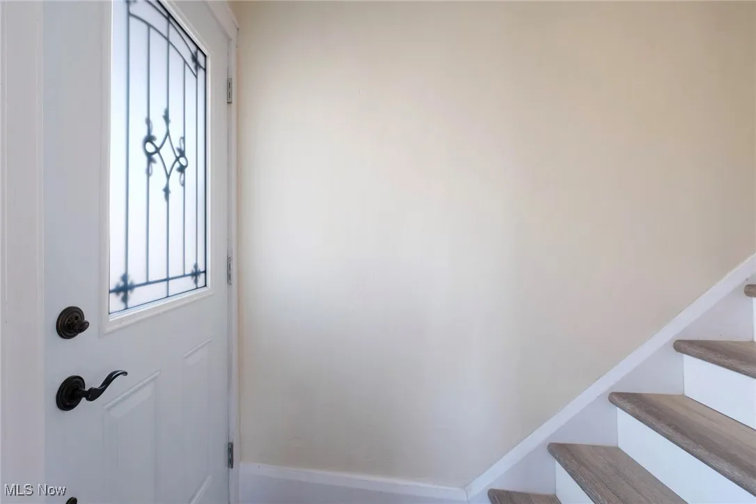 Entryway featuring stairs