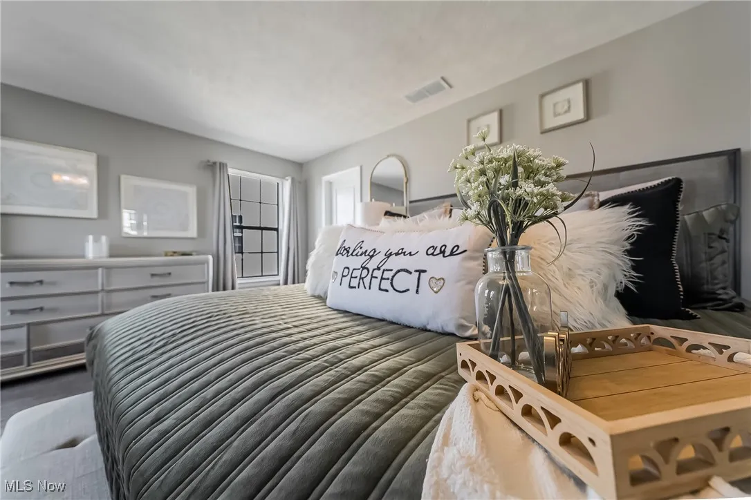 Bedroom with visible vents