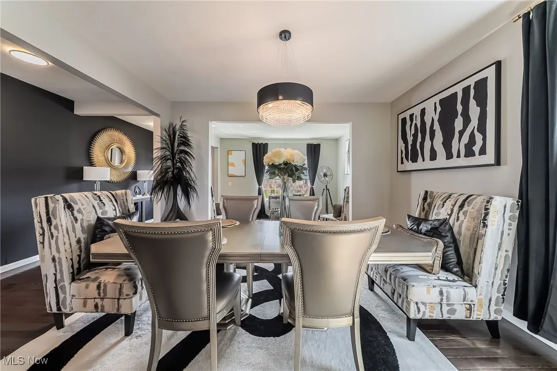 Dining area with wood finished floors and baseboards