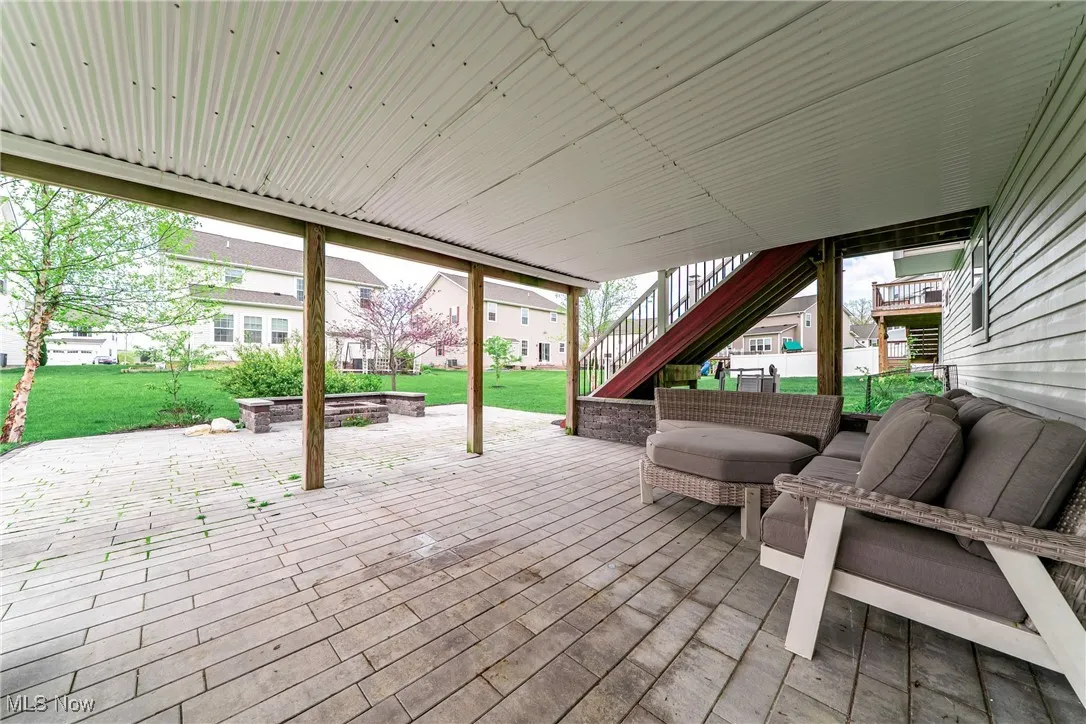 View of patio / terrace with stairway and an outdoor living space
