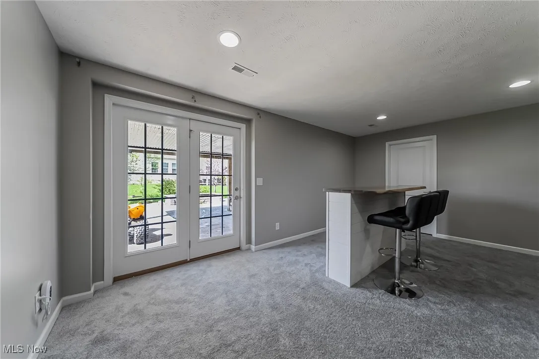 Unfurnished office featuring baseboards, recessed lighting, carpet flooring, and visible vents