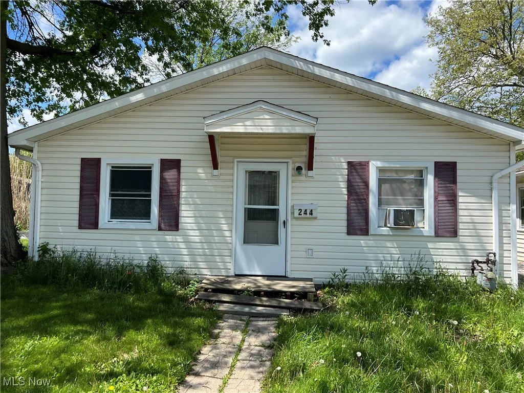 View of front of house featuring cooling unit
