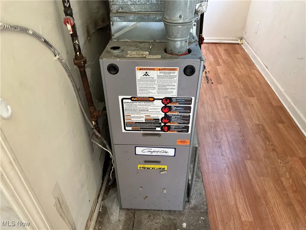 Utility room featuring heating unit