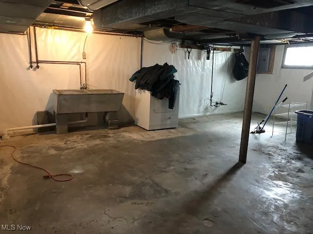 Below grade area featuring a sink