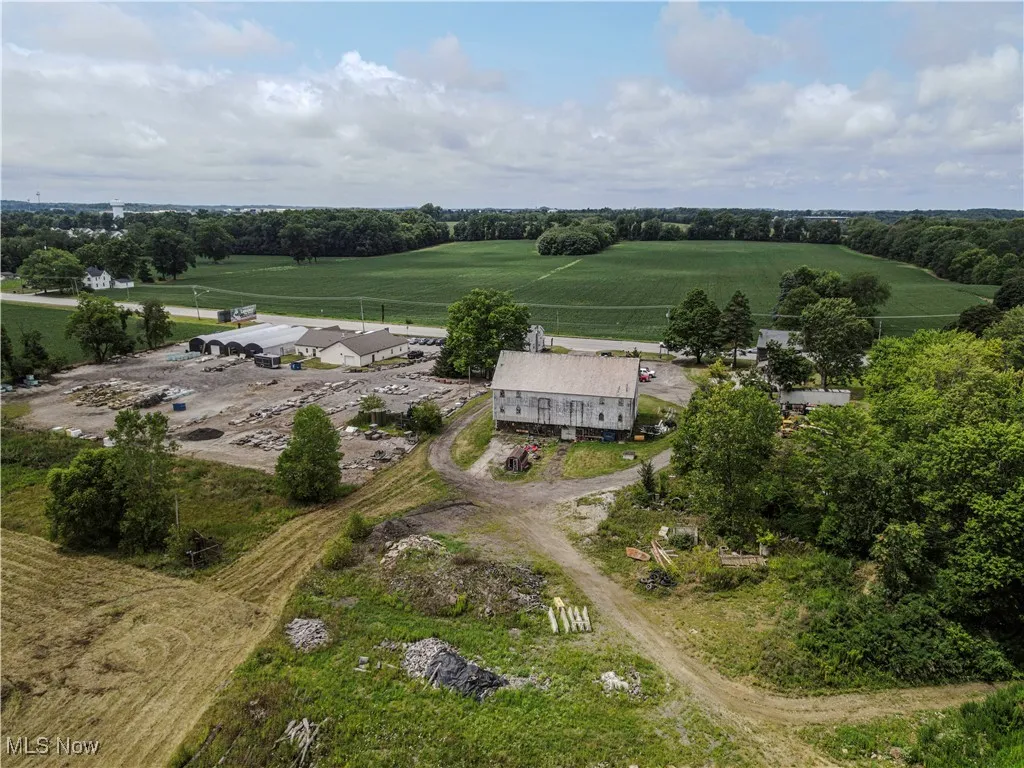Birds eye view of property with a rural view