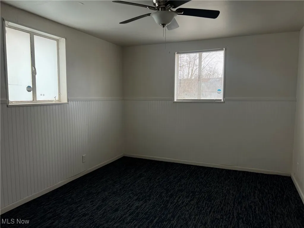 Bedroom with ceiling fan.