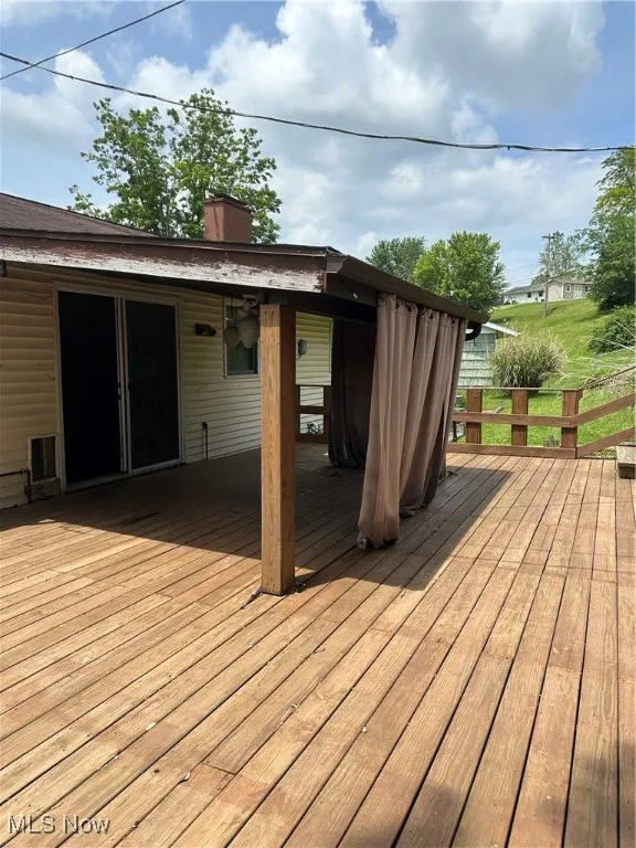 View of private backyard covered deck