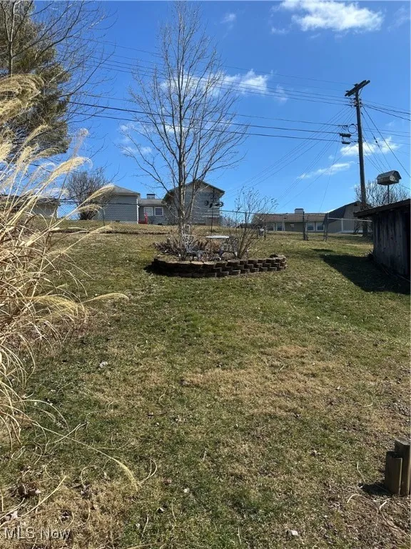 View of fenced in backyard