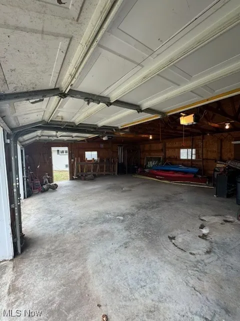 Garage featuring a garage door opener