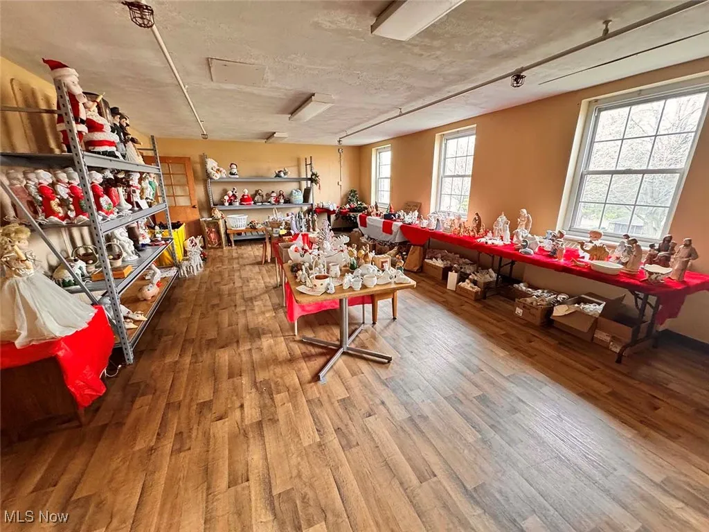 Miscellaneous room featuring wood finished floors
