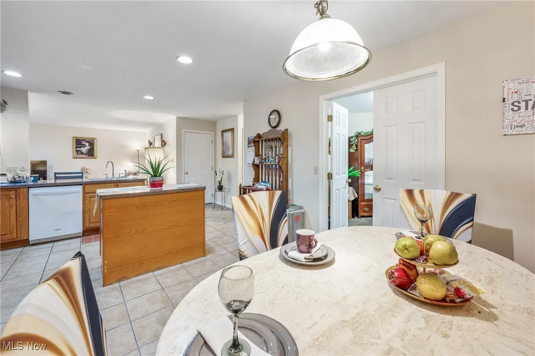 Dining room featuring recessed lighting and light tile patterned floors