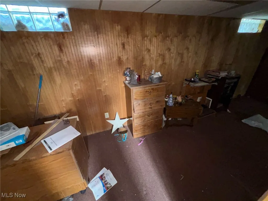 Misc room featuring wooden walls