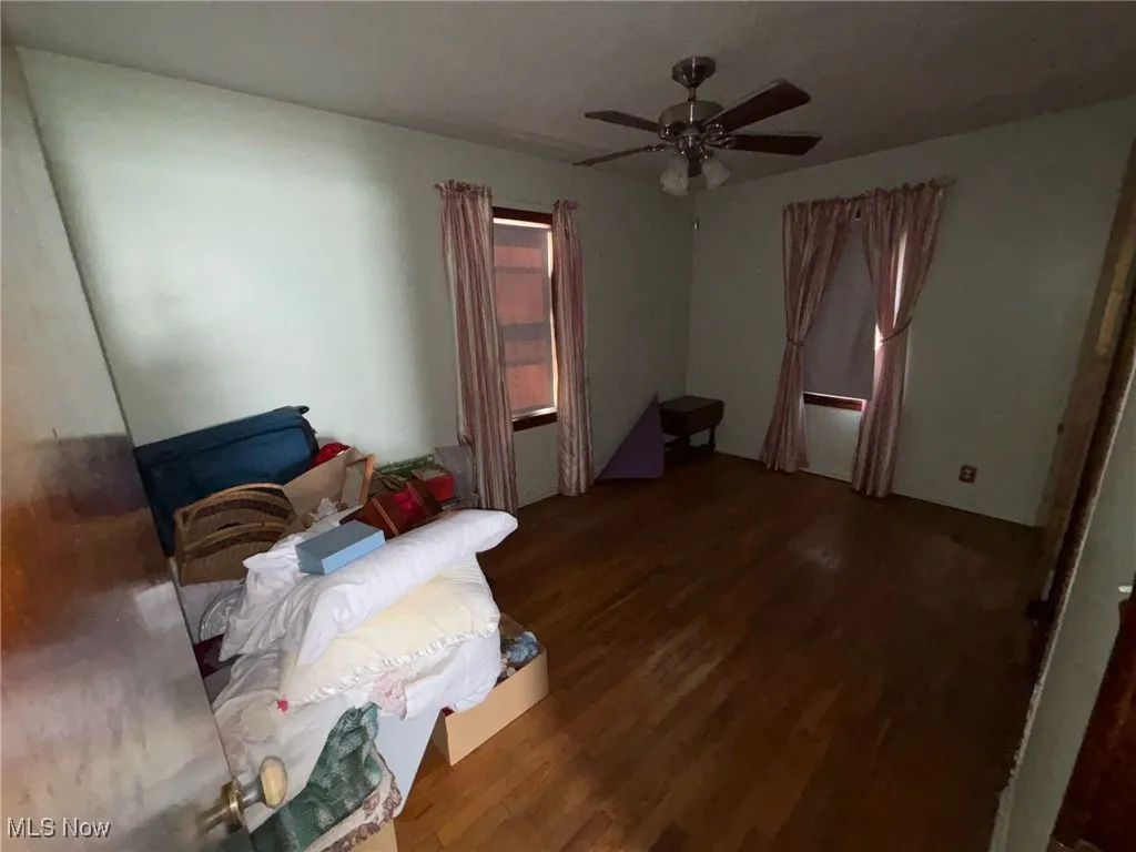 Bedroom featuring a ceiling fan and wood finished floors