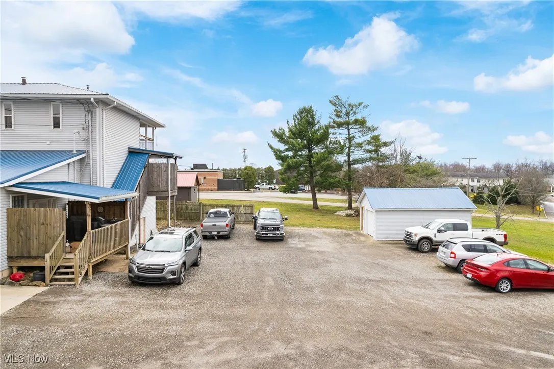 Rear parking area. Extra bldg for storage.