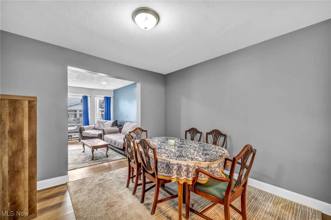 Dining area with baseboards and wood finished floors